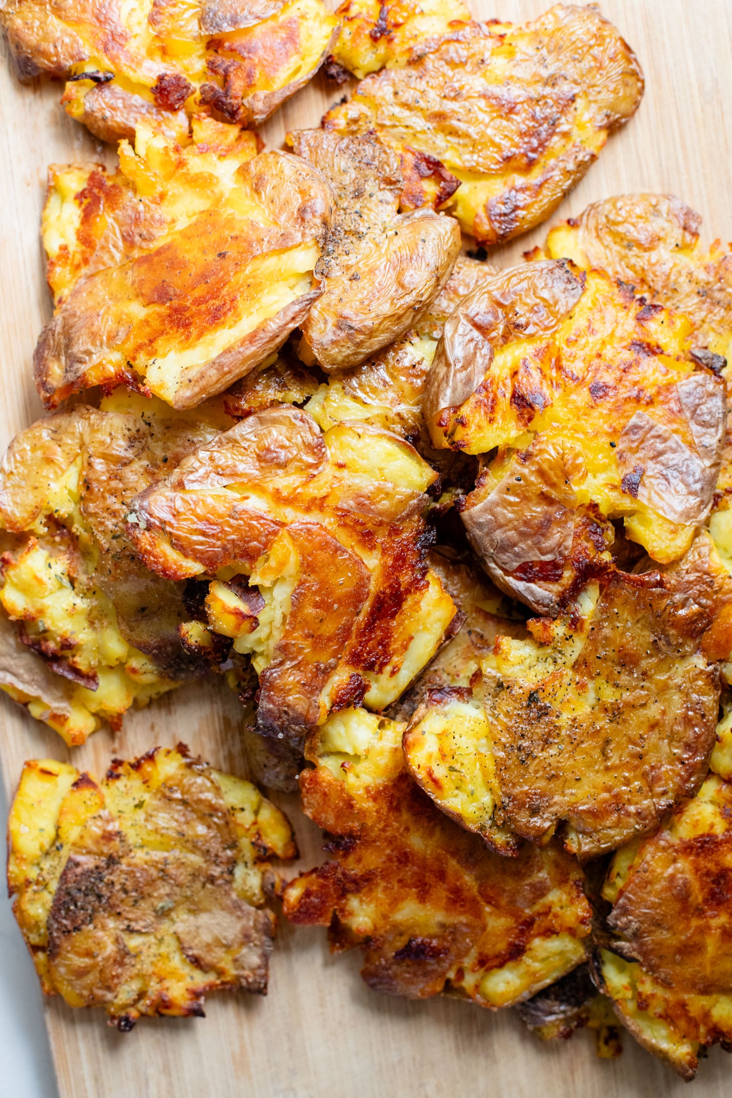 This Vegan Smashed Potato Salad is made with Yukon gold potatoes that are crisped up in the oven and tossed in a dairy-free dressing | ThisSavoryVegan.com