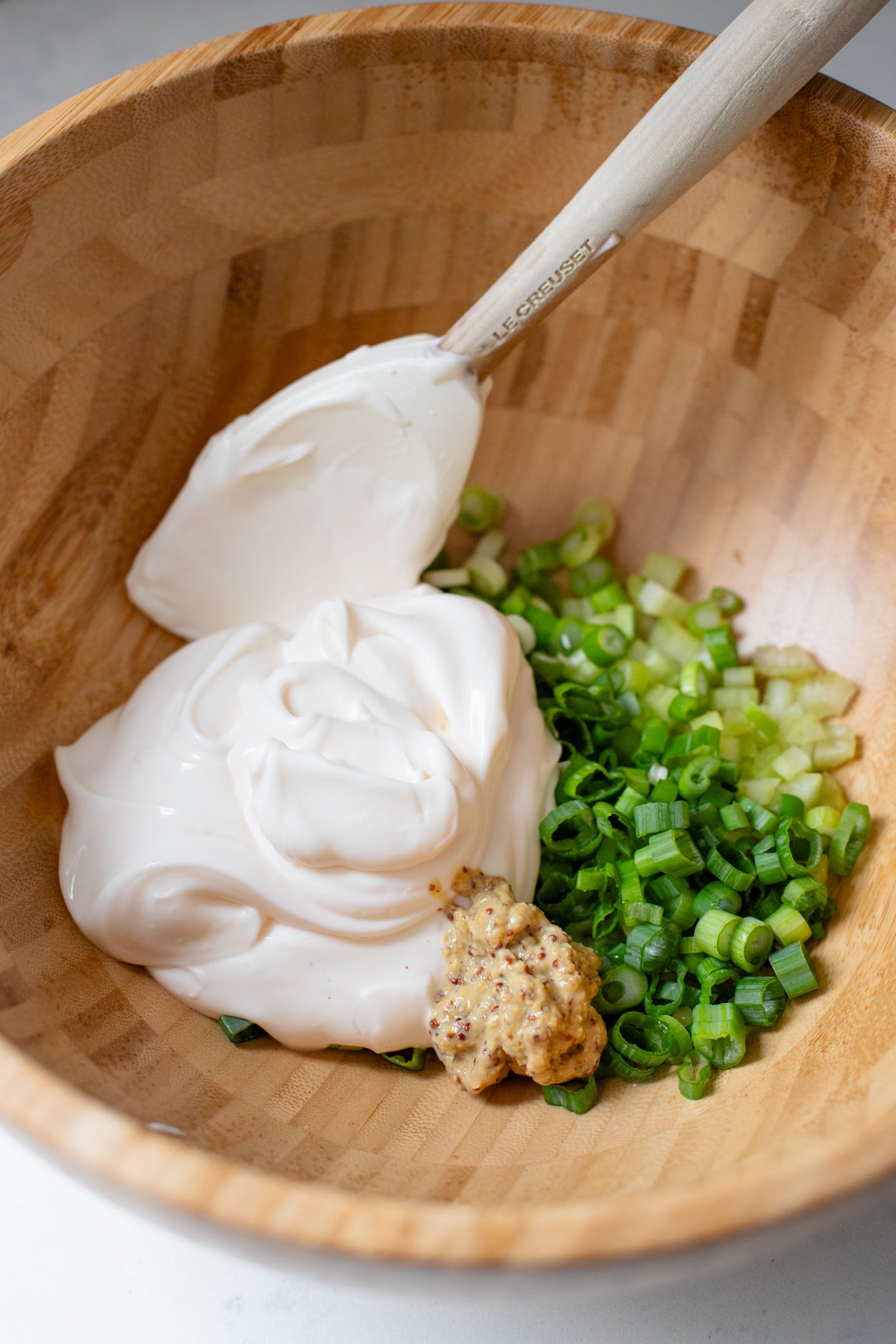 This Vegan Smashed Potato Salad is made with Yukon gold potatoes that are crisped up in the oven and tossed in a dairy-free dressing | ThisSavoryVegan.com