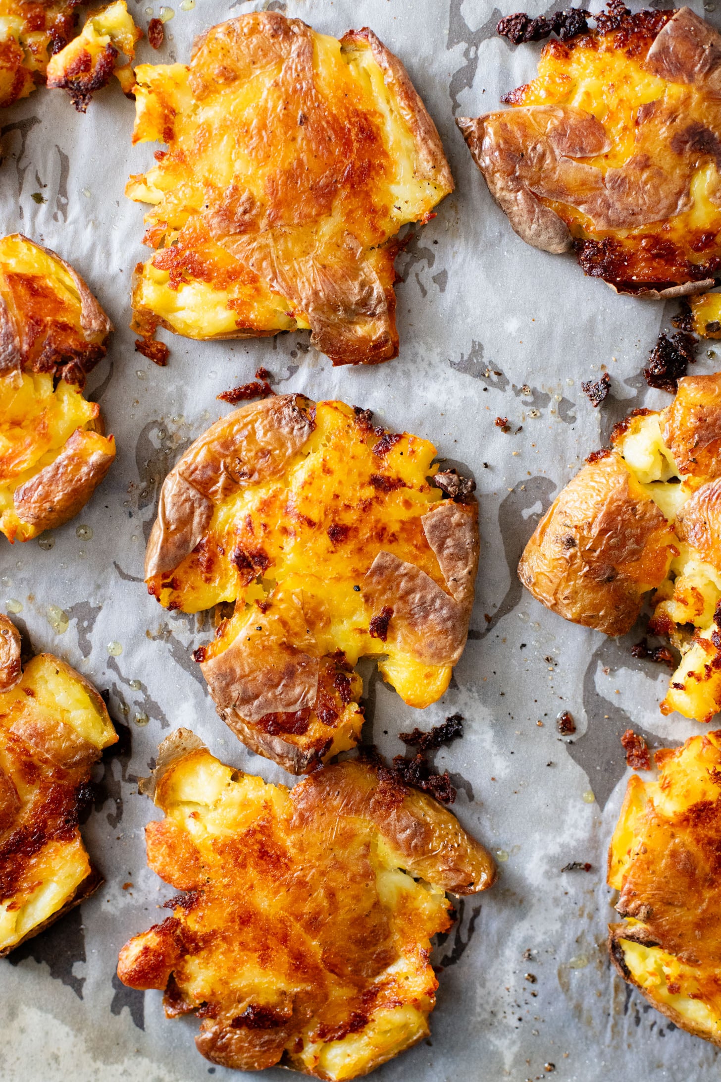 This Vegan Smashed Potato Salad is made with Yukon gold potatoes that are crisped up in the oven and tossed in a dairy-free dressing | ThisSavoryVegan.com