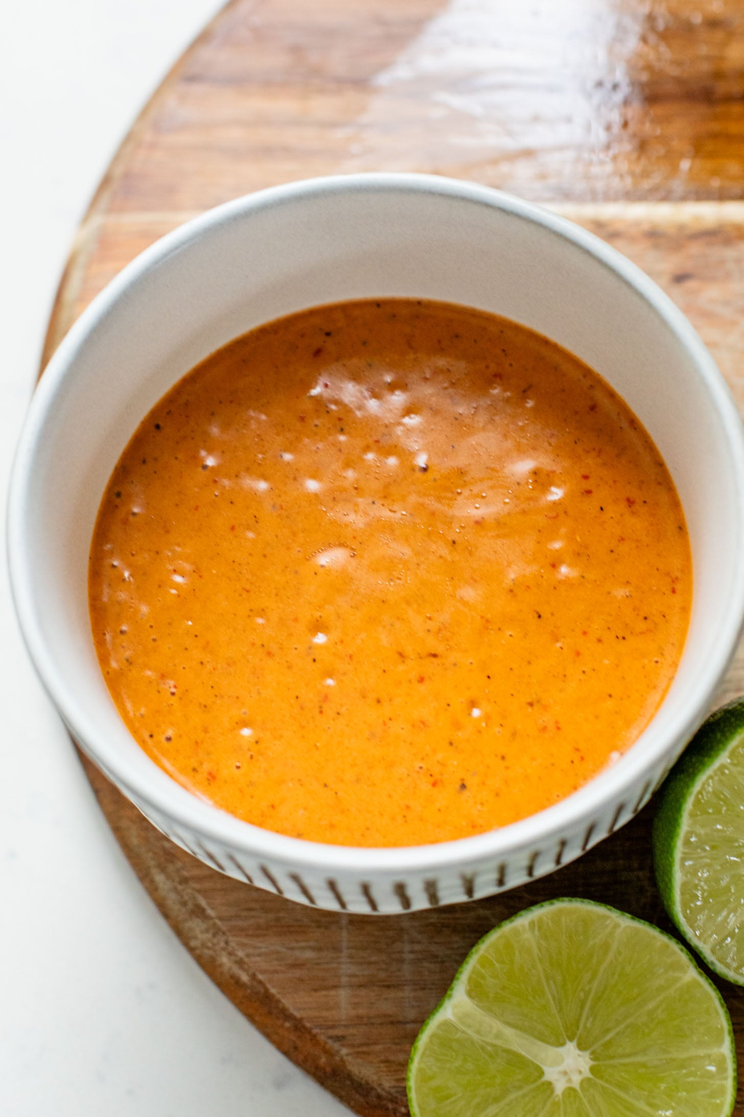 These Roasted Cauliflower & Potato Bowls are layered with seasoned roasted veggies, fresh romaine & a chipotle agave vinaigrette | ThisSavoryVegan.com