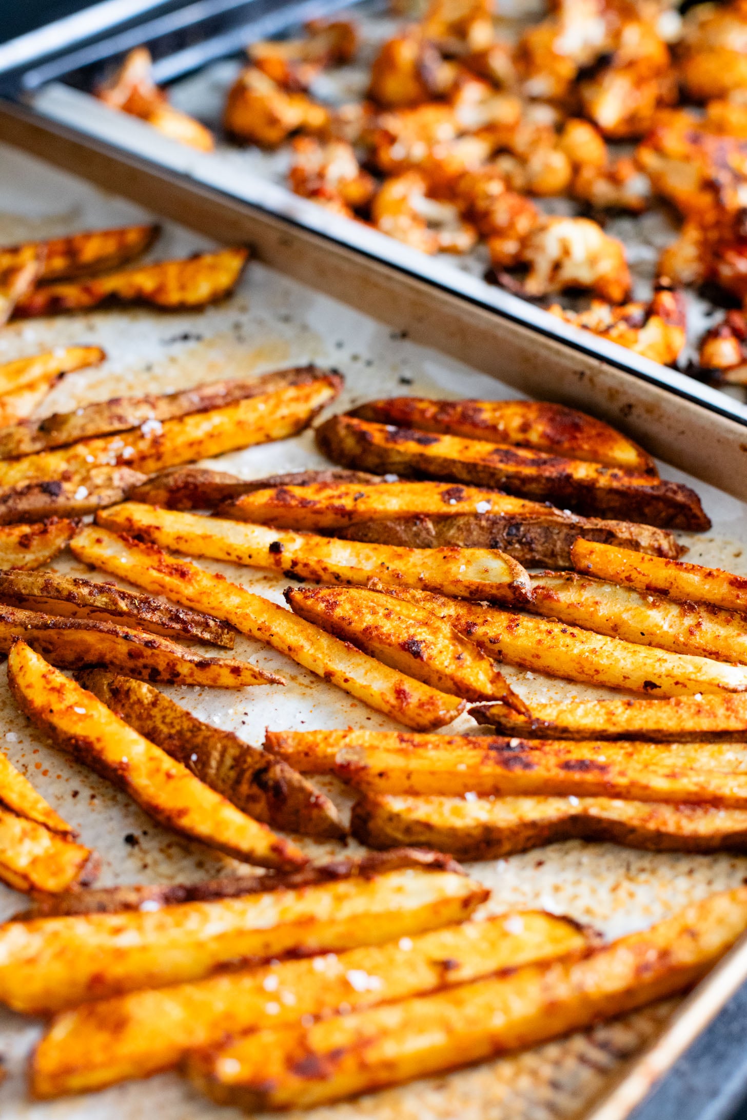 These Roasted Cauliflower & Potato Bowls are layered with seasoned roasted veggies, fresh romaine & a chipotle agave vinaigrette | ThisSavoryVegan.com