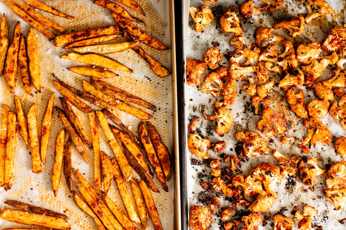 These Roasted Cauliflower & Potato Bowls are layered with seasoned roasted veggies, fresh romaine & a chipotle agave vinaigrette | ThisSavoryVegan.com