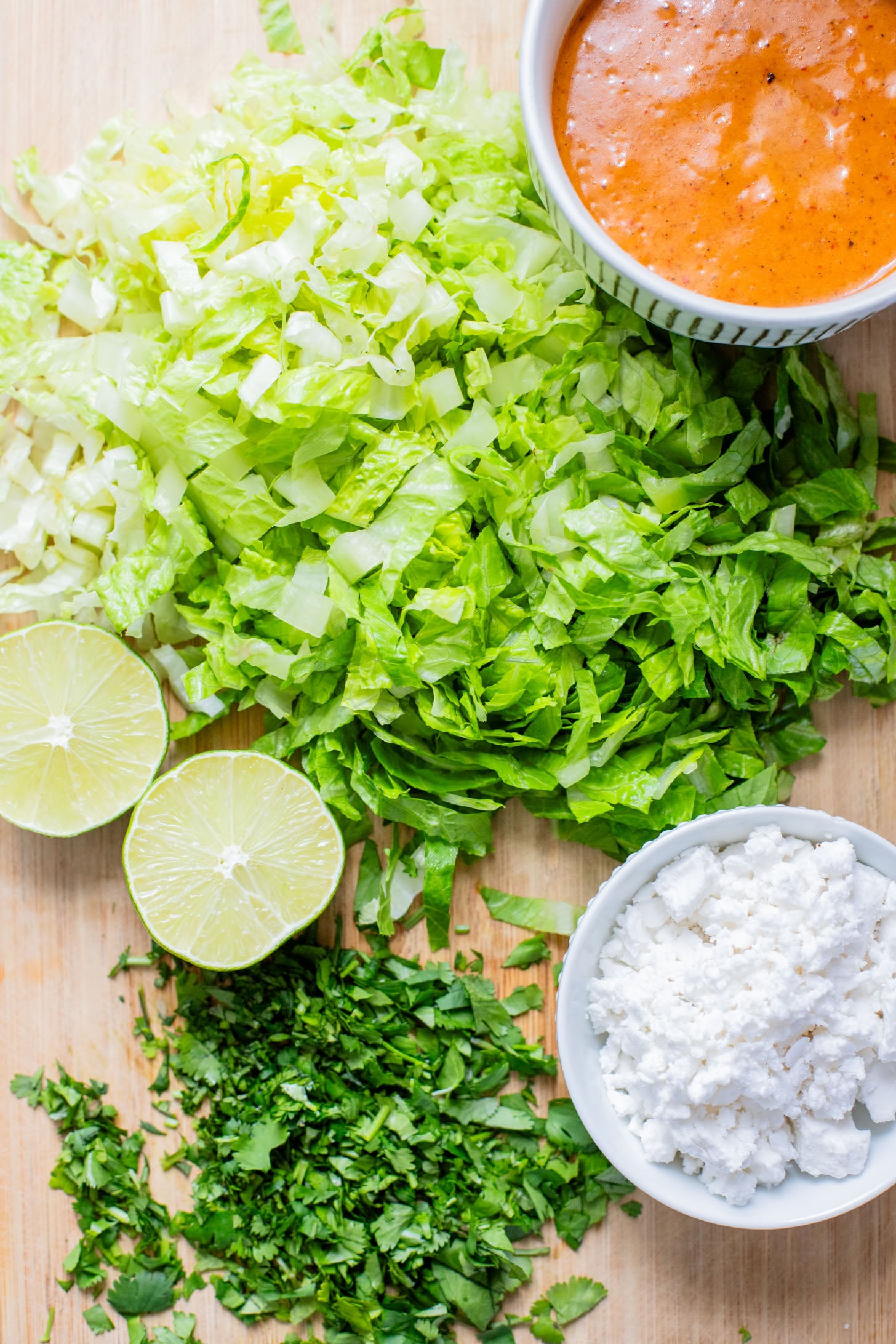 These Roasted Cauliflower & Potato Bowls are layered with seasoned roasted veggies, fresh romaine & a chipotle agave vinaigrette | ThisSavoryVegan.com