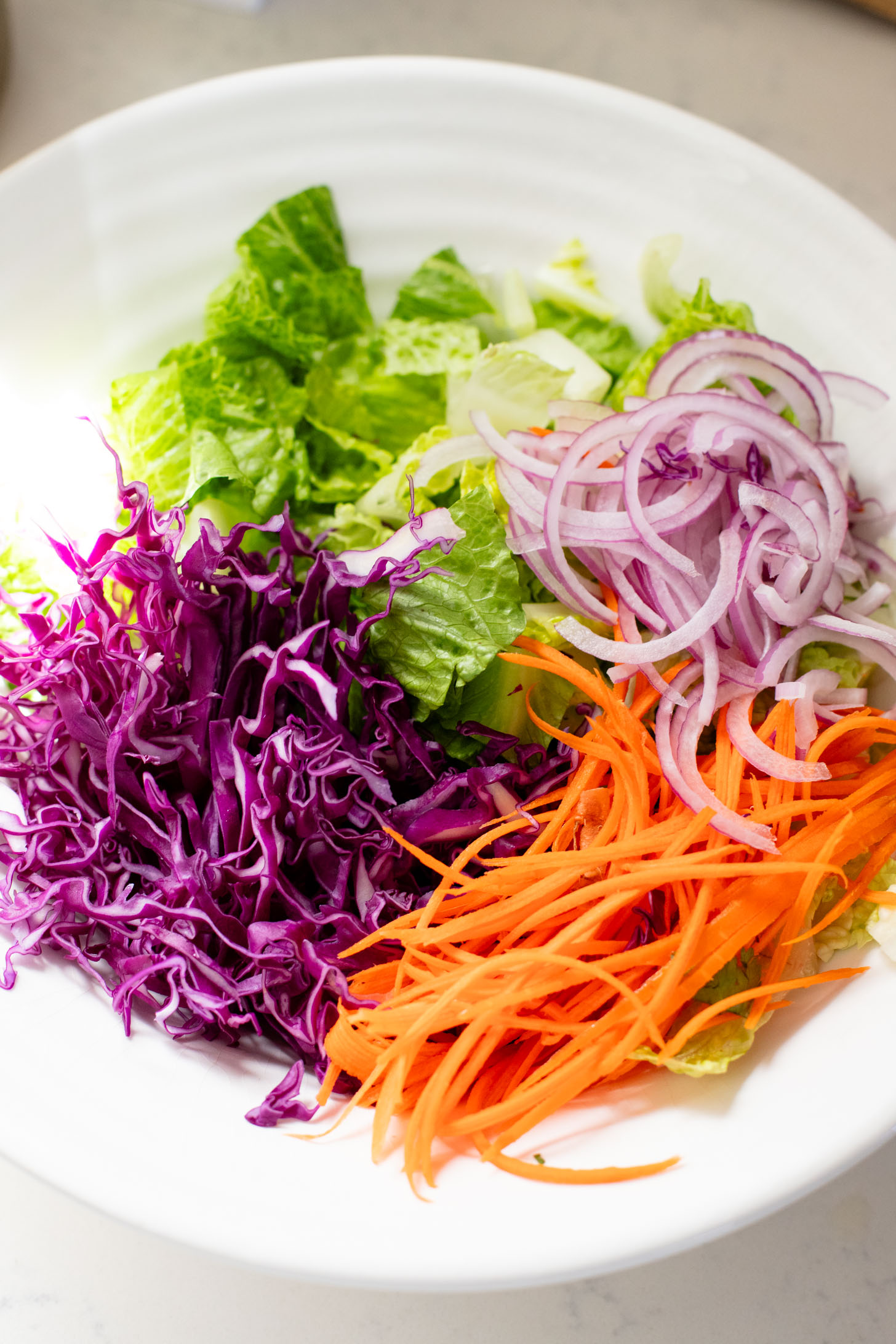 Loaded with crispy buffalo tempeh, vegan ranch and all the crunchy veggies, this Buffalo Tempeh Salad is a healthy, simple and delicious vegan salad | ThisSavoryVegan.com