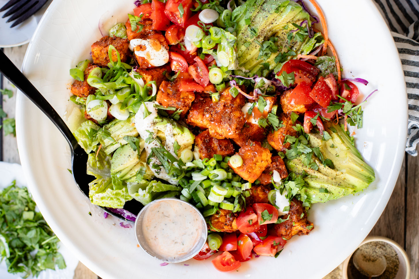 Loaded with crispy buffalo tempeh, vegan ranch and all the crunchy veggies, this Buffalo Tempeh Salad is a healthy, simple and delicious vegan salad | ThisSavoryVegan.com
