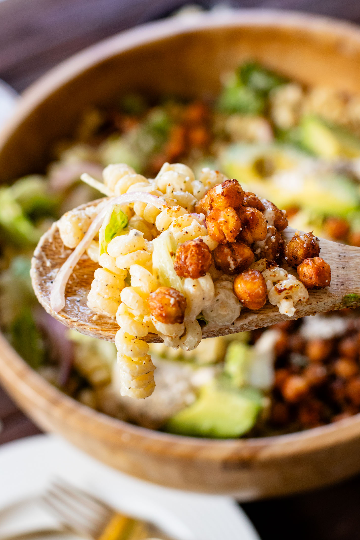 Zesty & delicious, this Cajun Caesar Pasta Salad is made with dairy-free caesar dressing, crispy chickpeas, romaine, avocado & fusilli pasta | ThisSavoryVegan.com