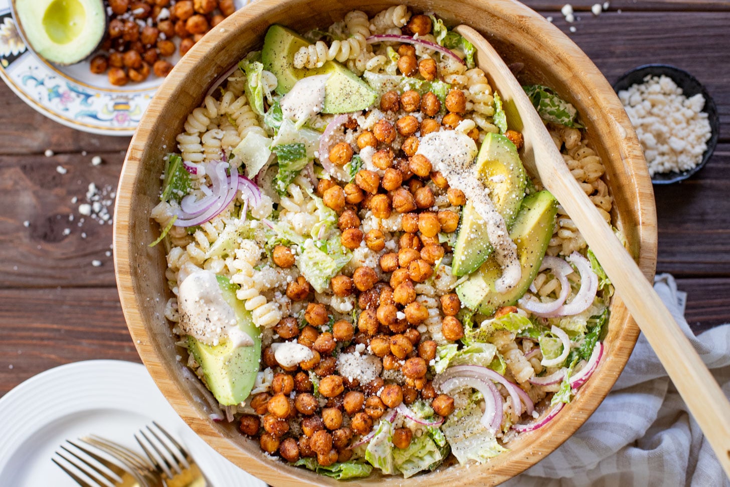Zesty & delicious, this Cajun Caesar Pasta Salad is made with dairy-free caesar dressing, crispy chickpeas, romaine, avocado & fusilli pasta | ThisSavoryVegan.com