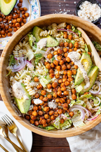 Zesty & delicious, this Cajun Caesar Pasta Salad is made with dairy-free caesar dressing, crispy chickpeas, romaine, avocado & fusilli pasta | ThisSavoryVegan.com