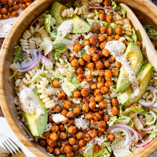 Zesty & delicious, this Cajun Caesar Pasta Salad is made with dairy-free caesar dressing, crispy chickpeas, romaine, avocado & fusilli pasta | ThisSavoryVegan.com
