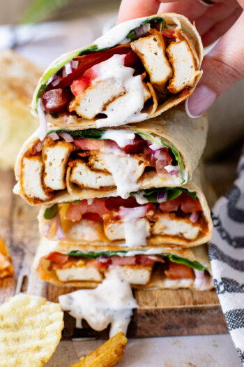 These Cajun Tofu Wraps are filled with baked cajun tofu, veggies and a dairy-free lemon pepper aioli. A great lunch or quick dinner | ThisSavoryVegan.com