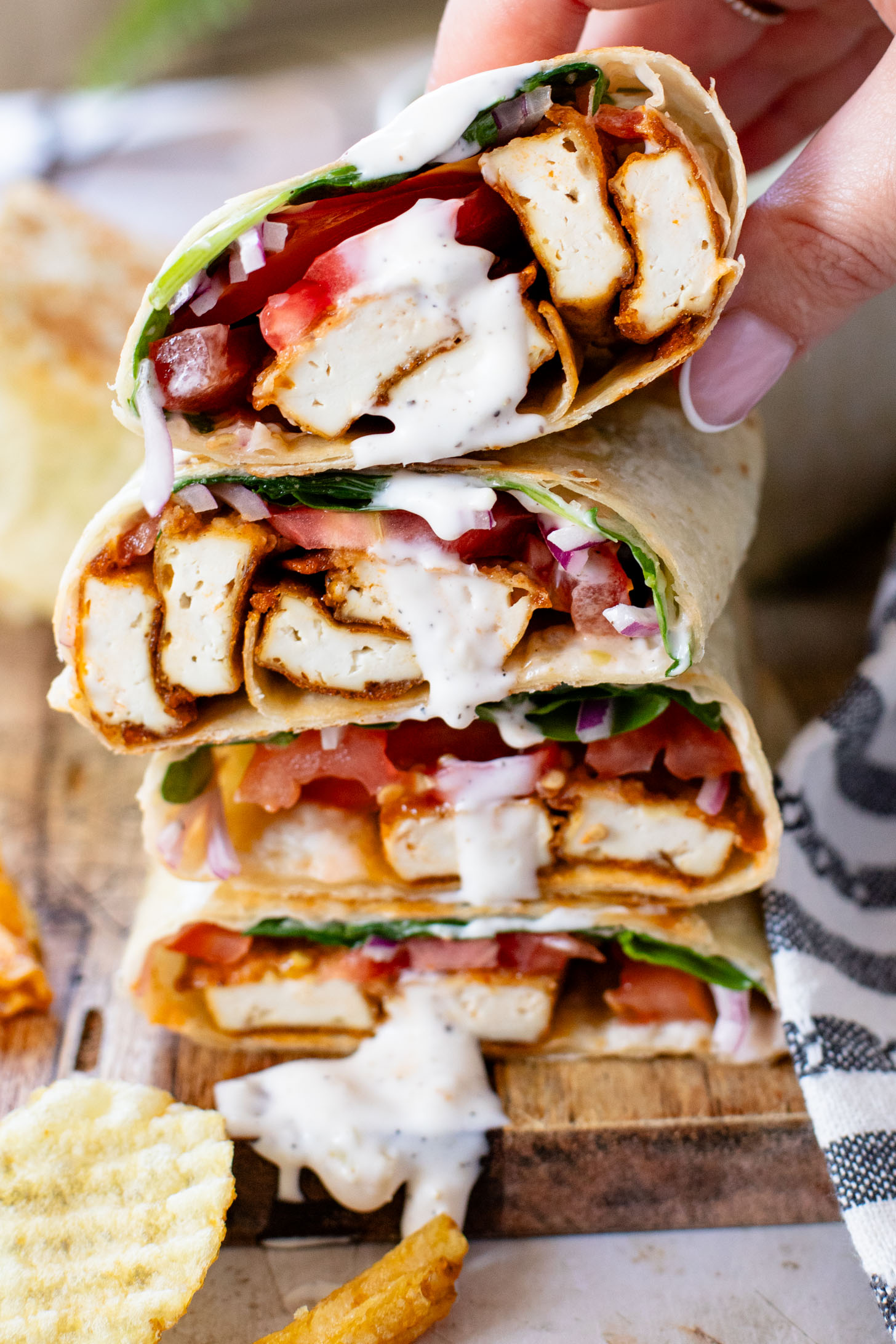 These Cajun Tofu Wraps are filled with baked cajun tofu, veggies and a dairy-free lemon pepper aioli. A great lunch or quick dinner | ThisSavoryVegan.com