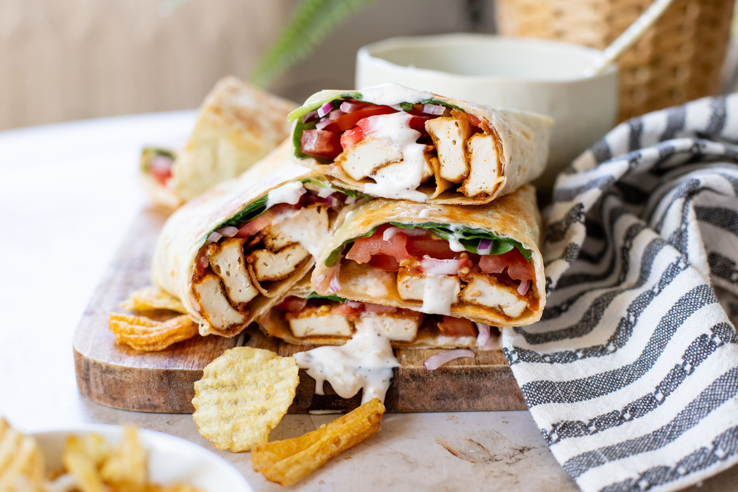 These Cajun Tofu Wraps are filled with baked cajun tofu, veggies and a dairy-free lemon pepper aioli. A great lunch or quick dinner | ThisSavoryVegan.com