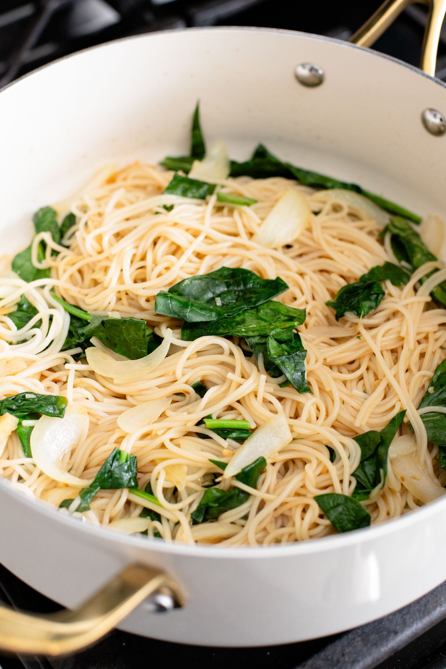 This Chili Crunch Tofu & Spinach Rice Noodles recipe is a better than takeout vegan dinner! Crispy tofu, veggie rice noodles & fresh herbs | ThisSavoryVegan.com