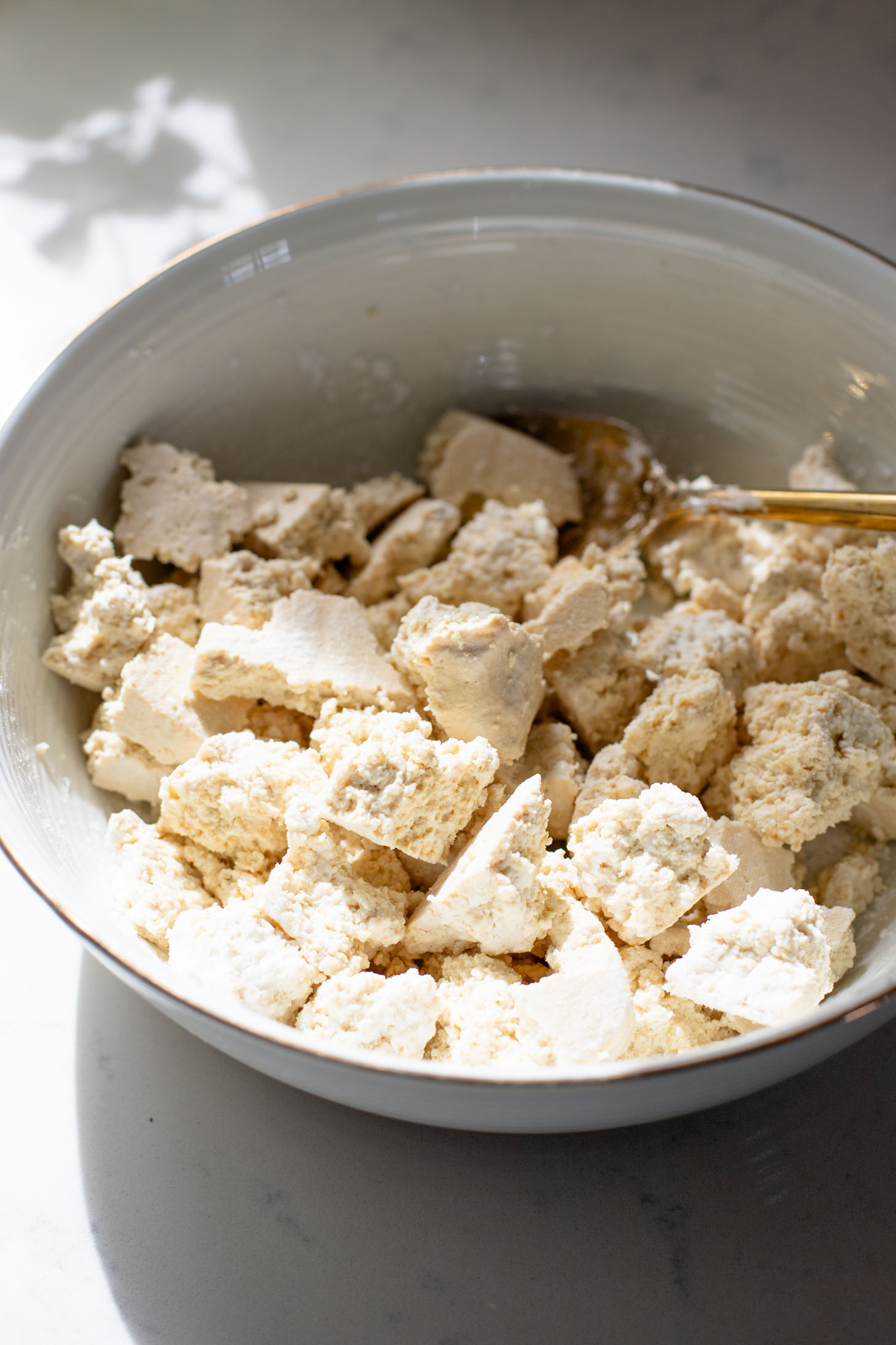 This Chili Crunch Tofu & Spinach Rice Noodles recipe is a better than takeout vegan dinner! Crispy tofu, veggie rice noodles & fresh herbs | ThisSavoryVegan.com