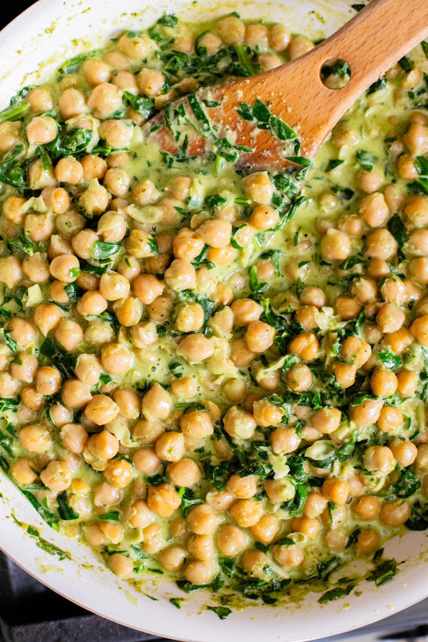 These Creamy Spinach & Pesto Chickpeas are served with lemon parmesan rice. A delicious vegan dinner that takes less than an hour | ThisSavoryVegan.com