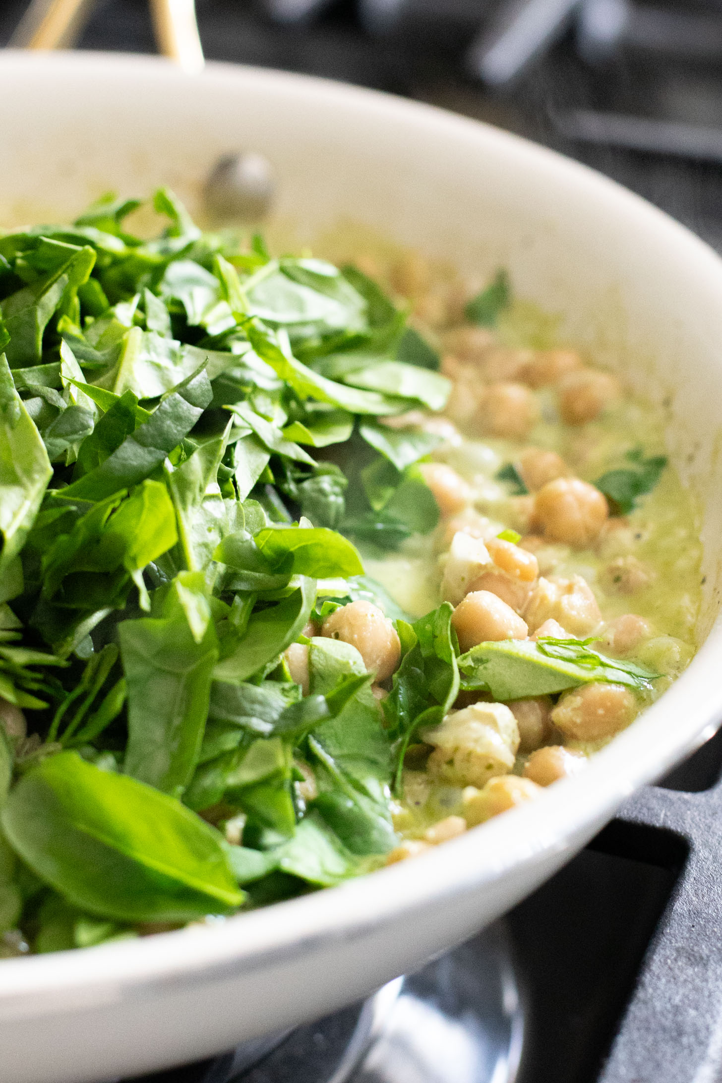 These Creamy Spinach & Pesto Chickpeas are served with lemon parmesan rice. A delicious vegan dinner that takes less than an hour | ThisSavoryVegan.com