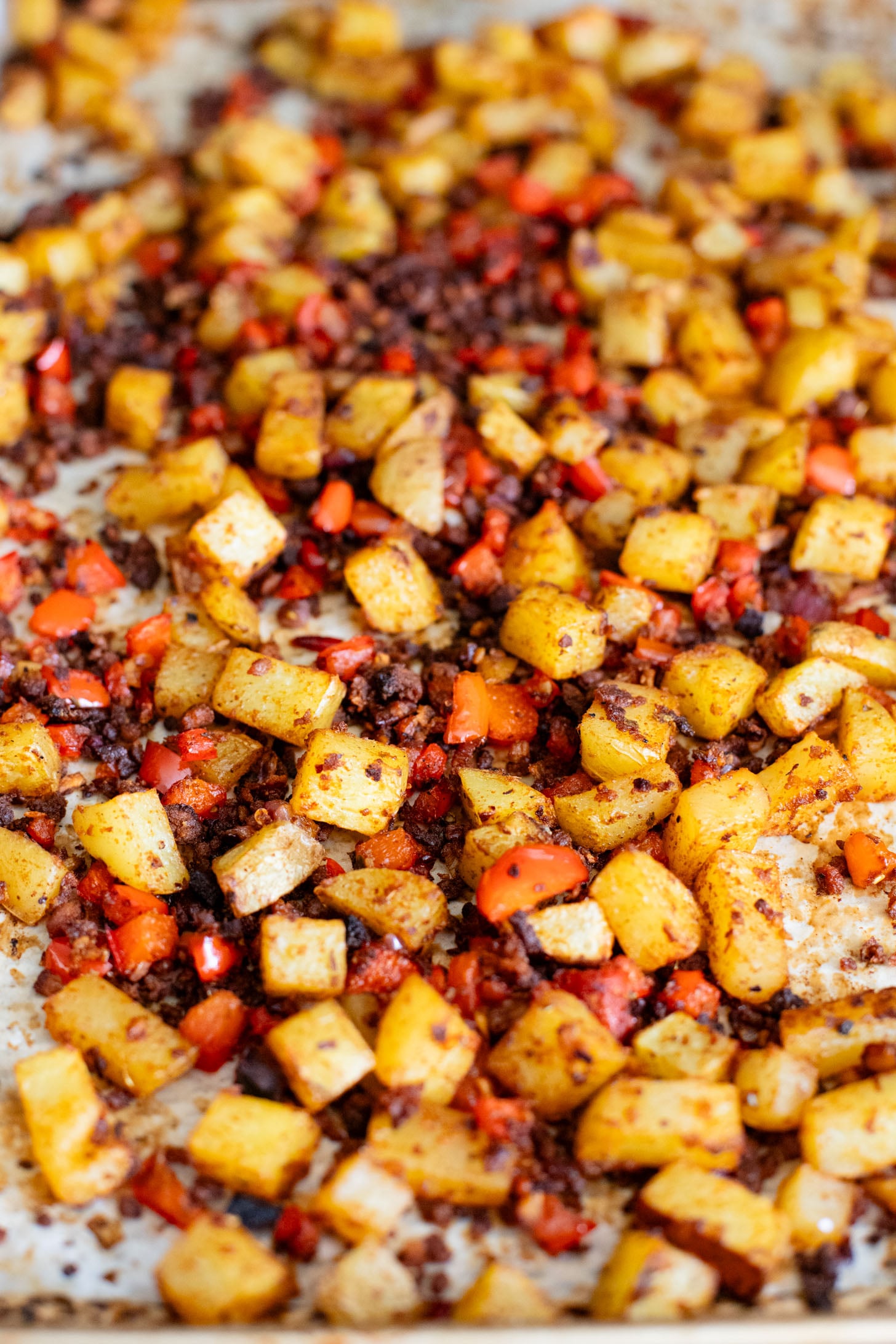 These Crispy Potato & Green Chile Rice Bowls are filled with flavor-packed rice, crispy potatoes, soy chorizo & a cilantro lime sauce | ThisSavoryVegan.com