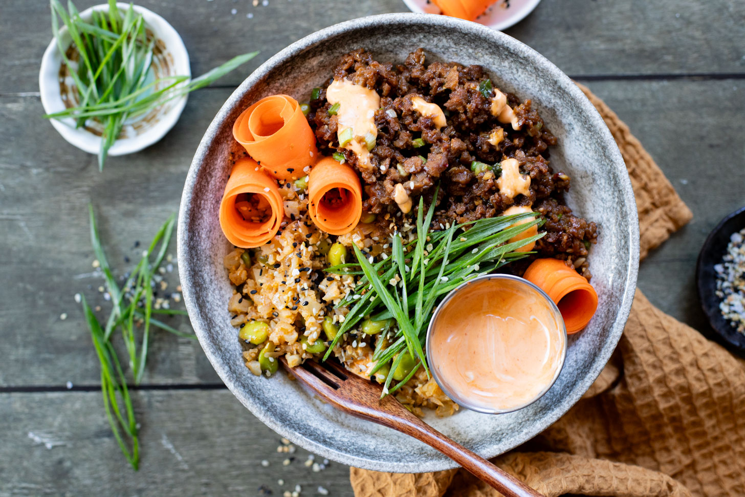 These Ginger Garlic Vegan Beef Bowls are layered with edamame cauliflower rice, saucy vegan beef crumbles and spicy mayo | ThisSavoryVegan.com