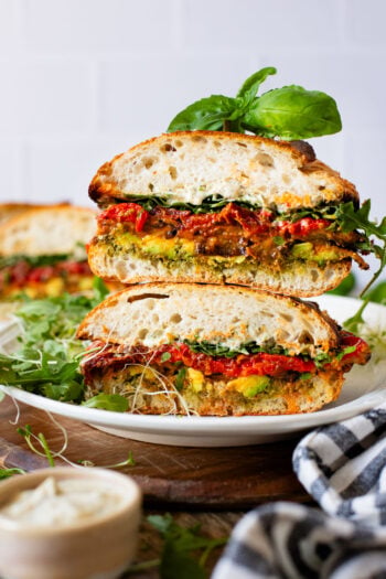 This Harissa Eggplant Picnic Sandwich is perfect for lunch outings. Made with ciabatta and layered with loads of veggies, pesto & tahini sauce | ThisSavoryVegan.com