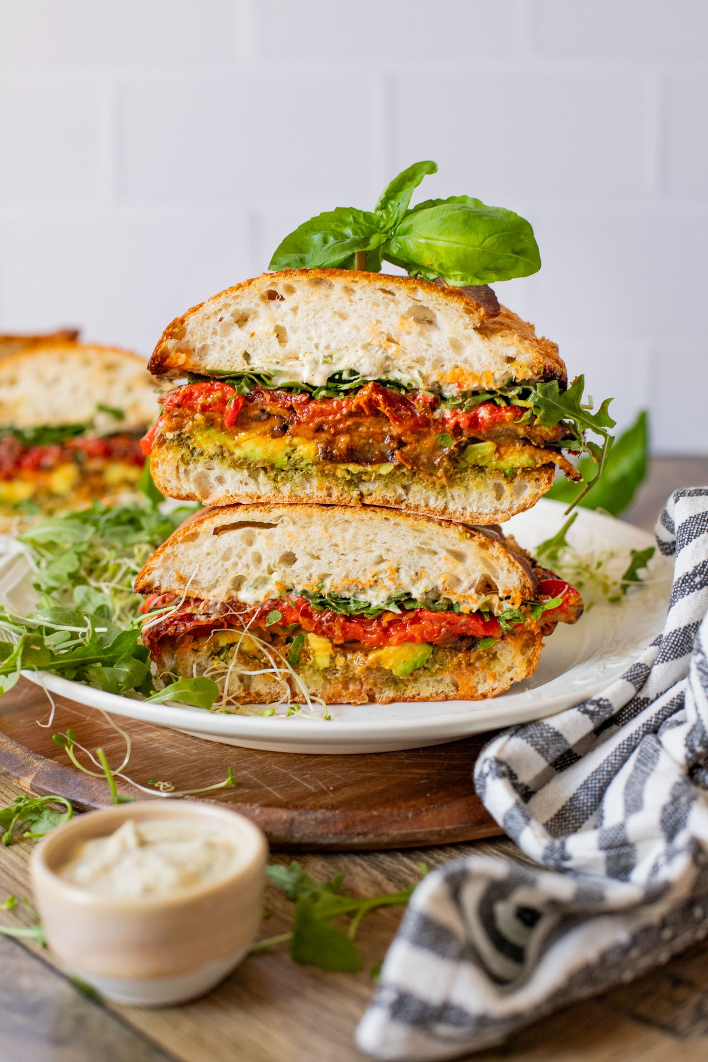 This Harissa Eggplant Picnic Sandwich is perfect for lunch outings. Made with ciabatta and layered with loads of veggies, pesto & tahini sauce | ThisSavoryVegan.com