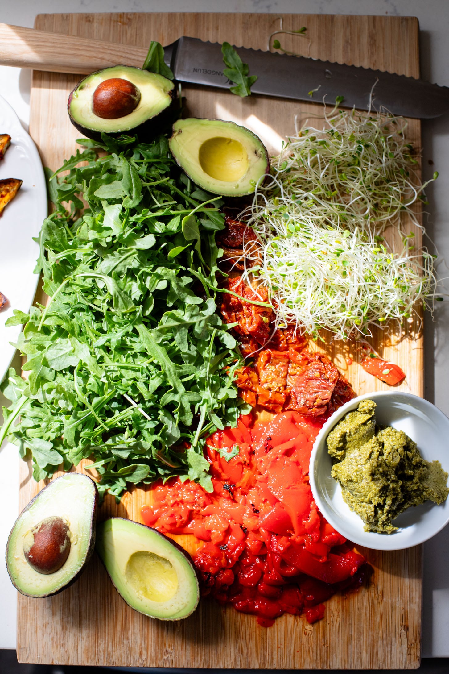 This Harissa Eggplant Picnic Sandwich is perfect for lunch outings. Made with ciabatta and layered with loads of veggies, pesto & tahini sauce | ThisSavoryVegan.com