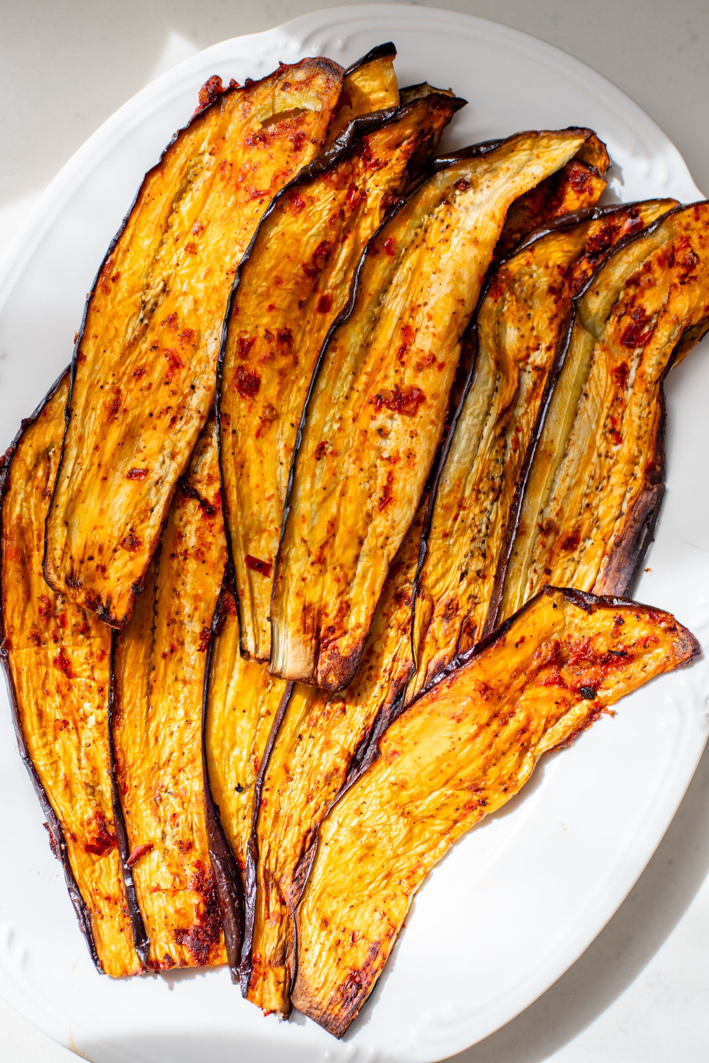 This Harissa Eggplant Picnic Sandwich is perfect for lunch outings. Made with ciabatta and layered with loads of veggies, pesto & tahini sauce | ThisSavoryVegan.com