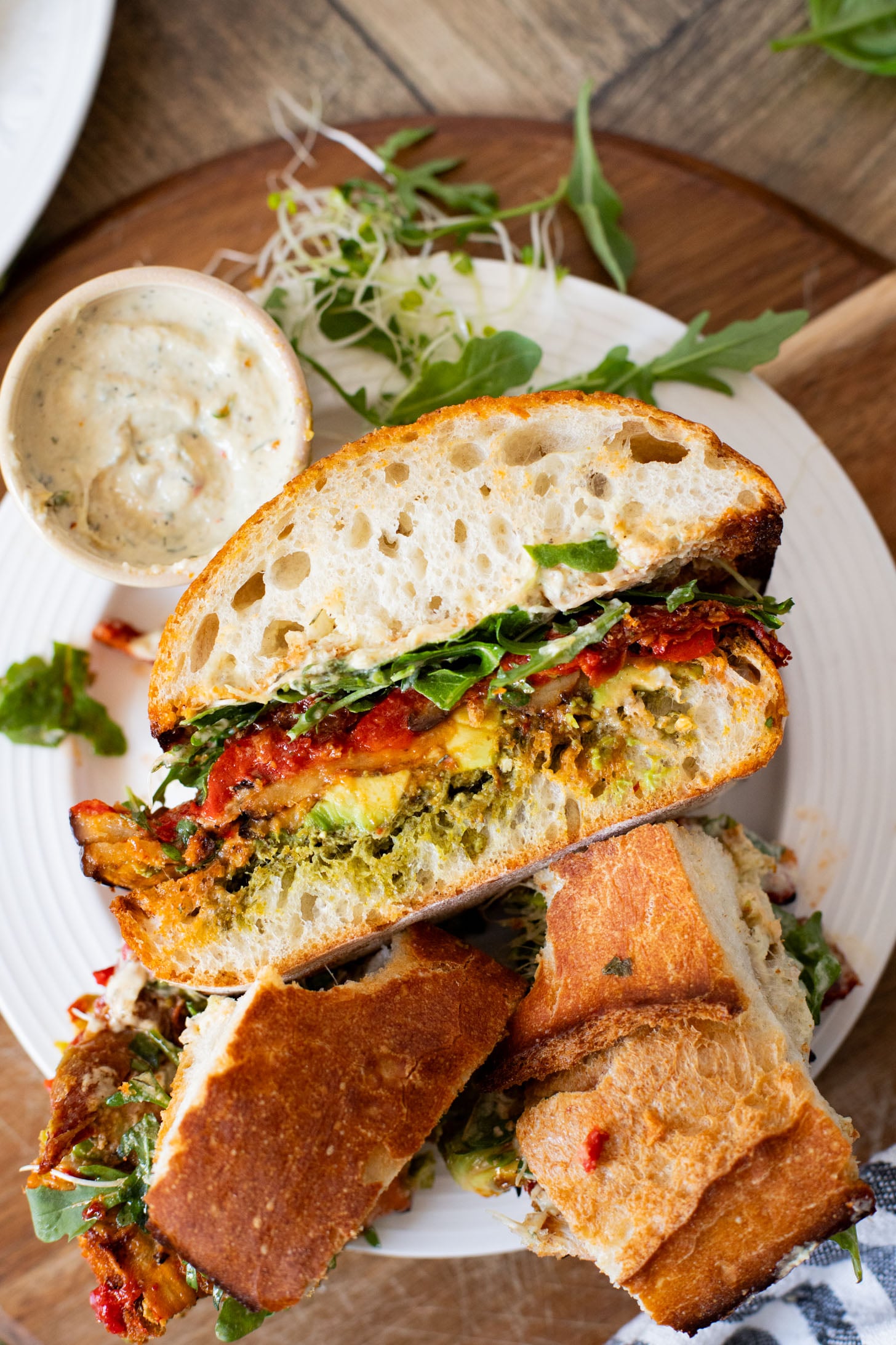 This Harissa Eggplant Picnic Sandwich is perfect for lunch outings. Made with ciabatta and layered with loads of veggies, pesto & tahini sauce | ThisSavoryVegan.com
