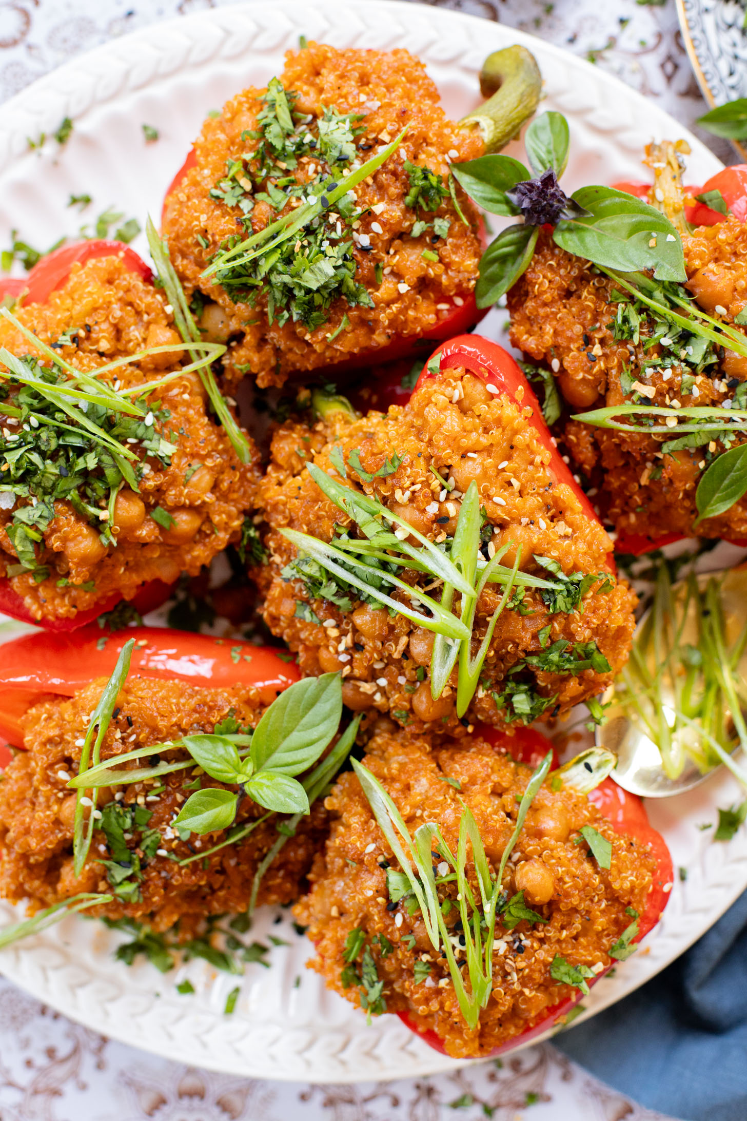 These Red Curry Quinoa Stuffed Peppers are Thai-inspired with quinoa & chickpeas cooked in a coconut red curry sauce & baked in bell peppers | ThisSavoryVegan.com