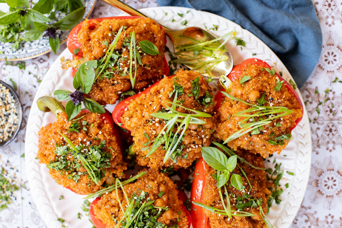 These Red Curry Quinoa Stuffed Peppers are Thai-inspired with quinoa & chickpeas cooked in a coconut red curry sauce & baked in bell peppers | ThisSavoryVegan.com