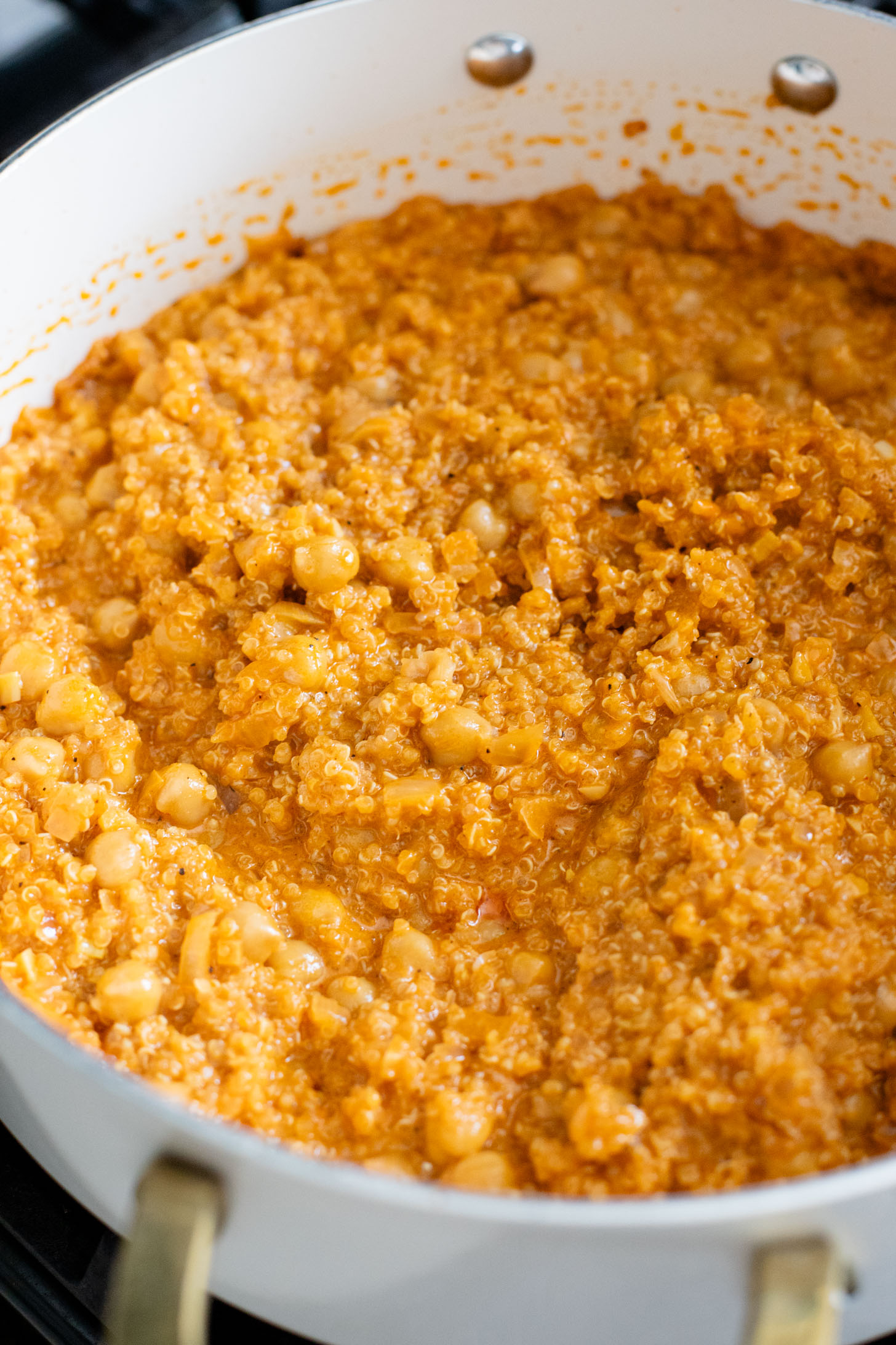 These Red Curry Quinoa Stuffed Peppers are Thai-inspired with quinoa & chickpeas cooked in a coconut red curry sauce & baked in bell peppers | ThisSavoryVegan.com