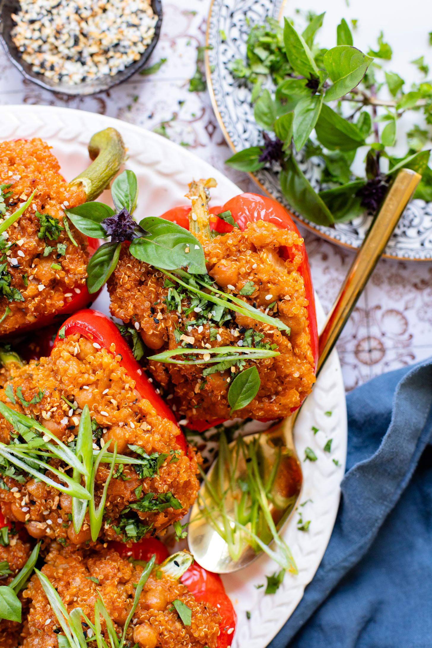 These Red Curry Quinoa Stuffed Peppers are Thai-inspired with quinoa & chickpeas cooked in a coconut red curry sauce & baked in bell peppers | ThisSavoryVegan.com