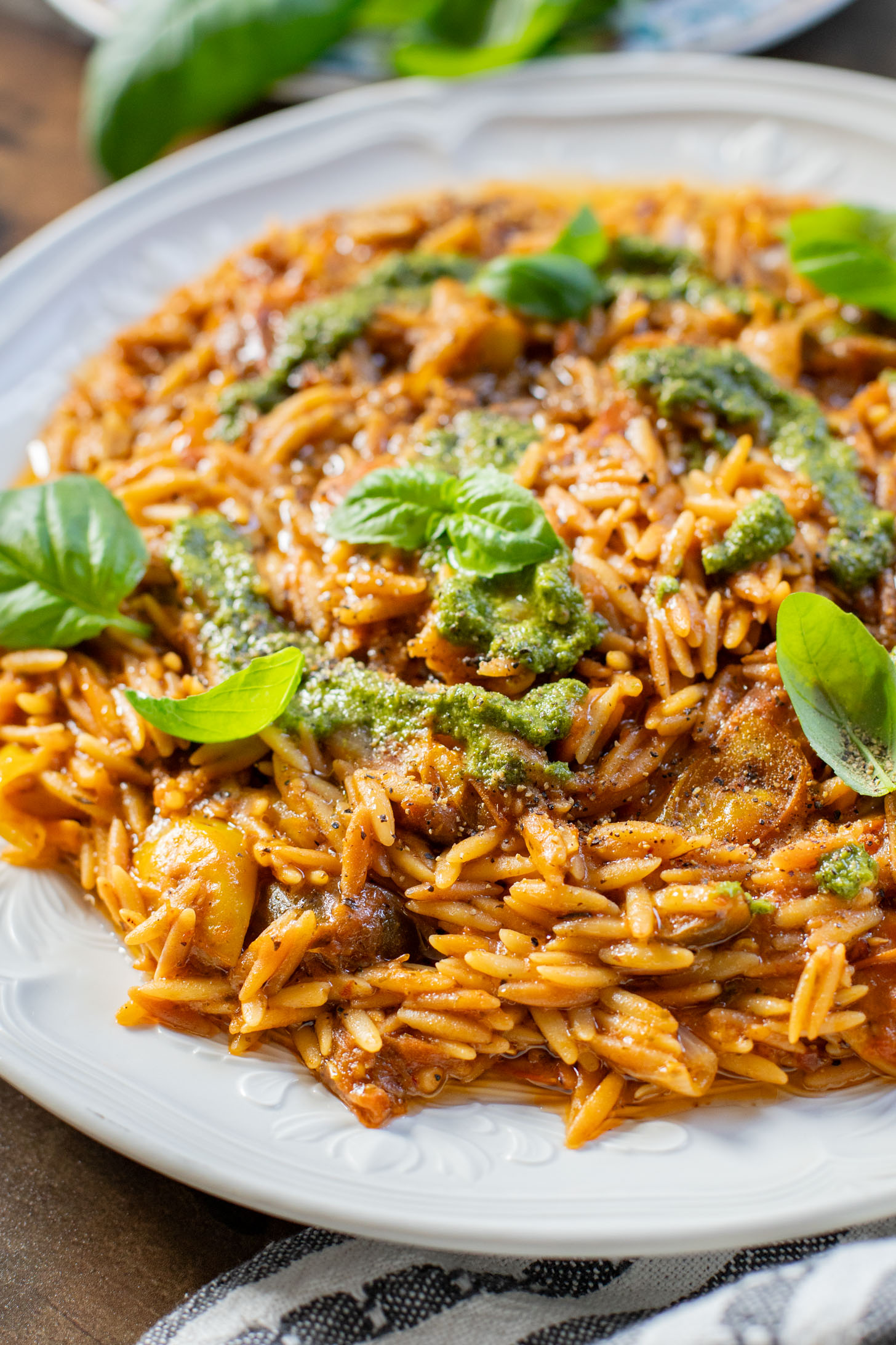 Creamy & delicious, this Roasted Tomato Pesto Orzo is a vegan dream! Tomatoes & garlic are roasted until tender and cooked with orzo & pesto | ThisSavoryVegan.com