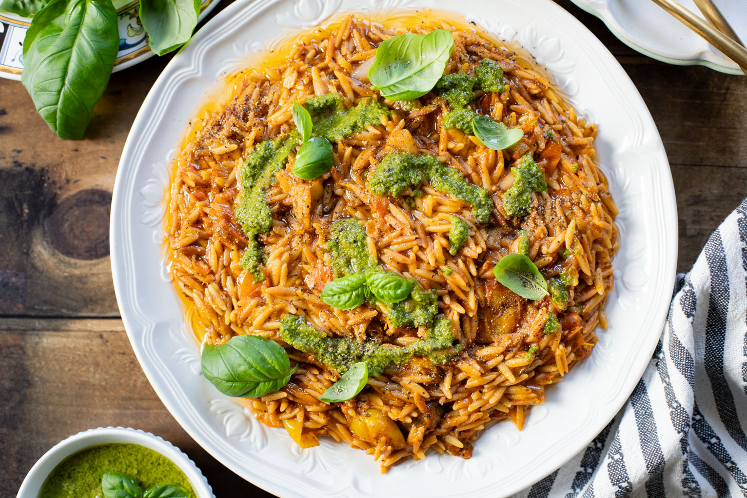 Creamy & delicious, this Roasted Tomato Pesto Orzo is a vegan dream! Tomatoes & garlic are roasted until tender and cooked with orzo & pesto | ThisSavoryVegan.com