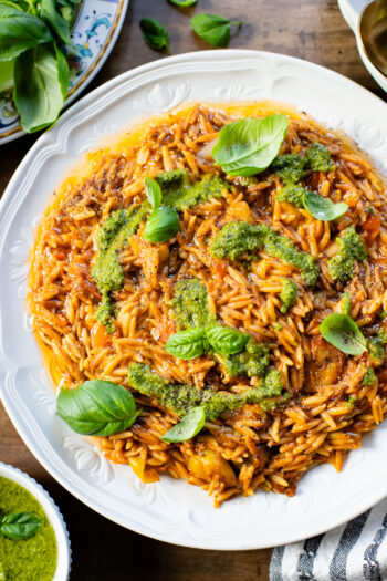 Creamy & delicious, this Roasted Tomato Pesto Orzo is a vegan dream! Tomatoes & garlic are roasted until tender and cooked with orzo & pesto | ThisSavoryVegan.com