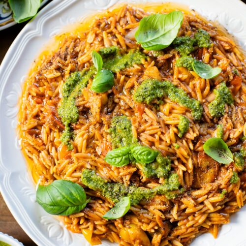 Creamy & delicious, this Roasted Tomato Pesto Orzo is a vegan dream! Tomatoes & garlic are roasted until tender and cooked with orzo & pesto | ThisSavoryVegan.com