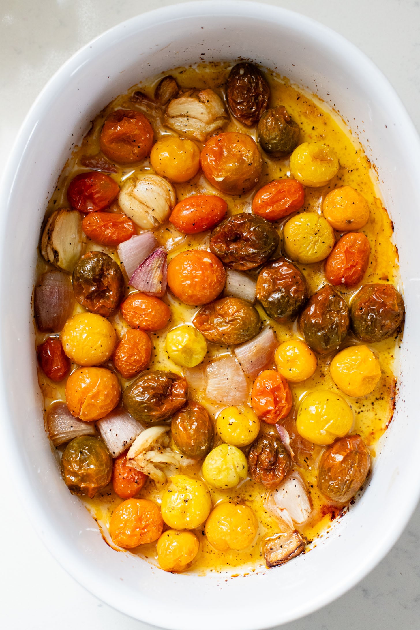 Creamy & delicious, this Roasted Tomato Pesto Orzo is a vegan dream! Tomatoes & garlic are roasted until tender and cooked with orzo & pesto | ThisSavoryVegan.com