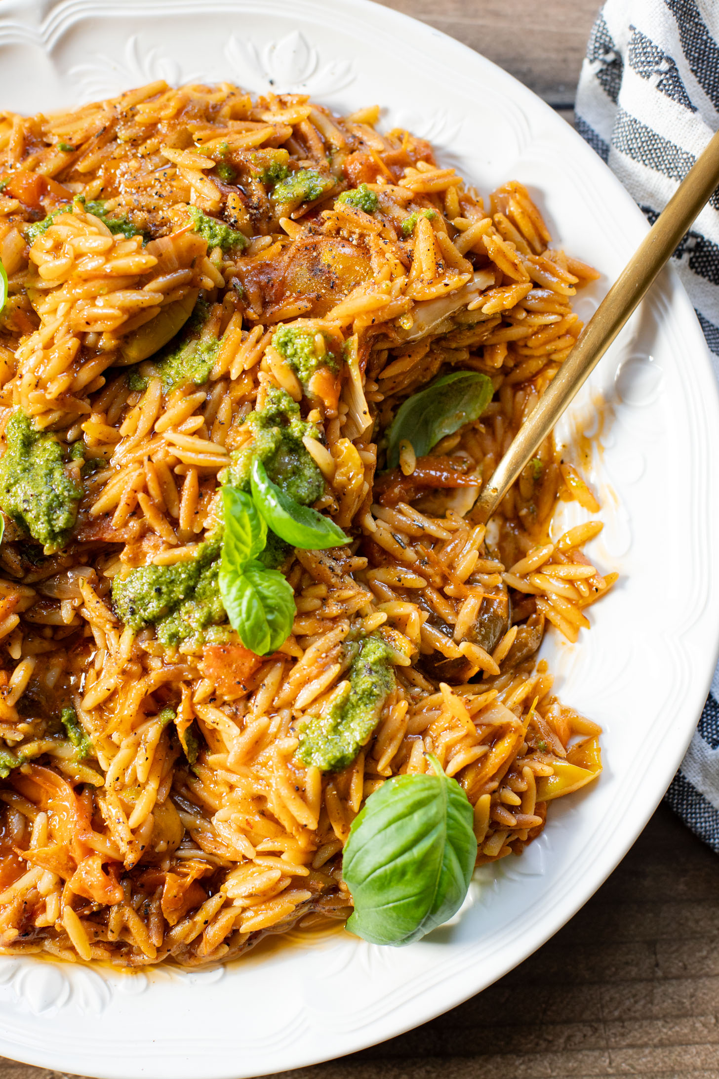 Creamy & delicious, this Roasted Tomato Pesto Orzo is a vegan dream! Tomatoes & garlic are roasted until tender and cooked with orzo & pesto | ThisSavoryVegan.com