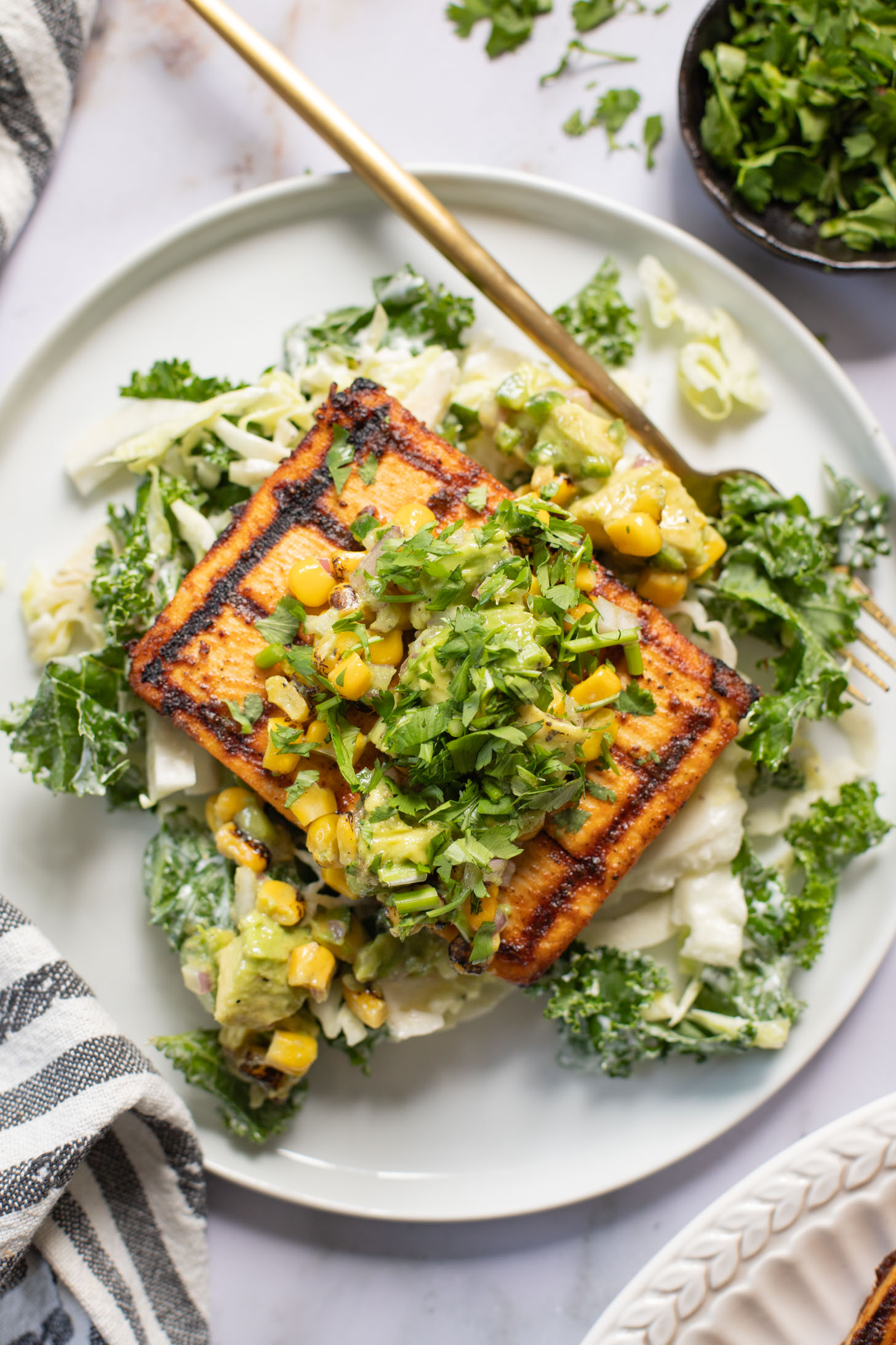 Get ready for grilling season with these Chipotle Tofu Steaks with Avocado Corn Salsa - made with Nasoya's Super Firm Tofu and grilled until crispy | ThisSavoryVegan.com