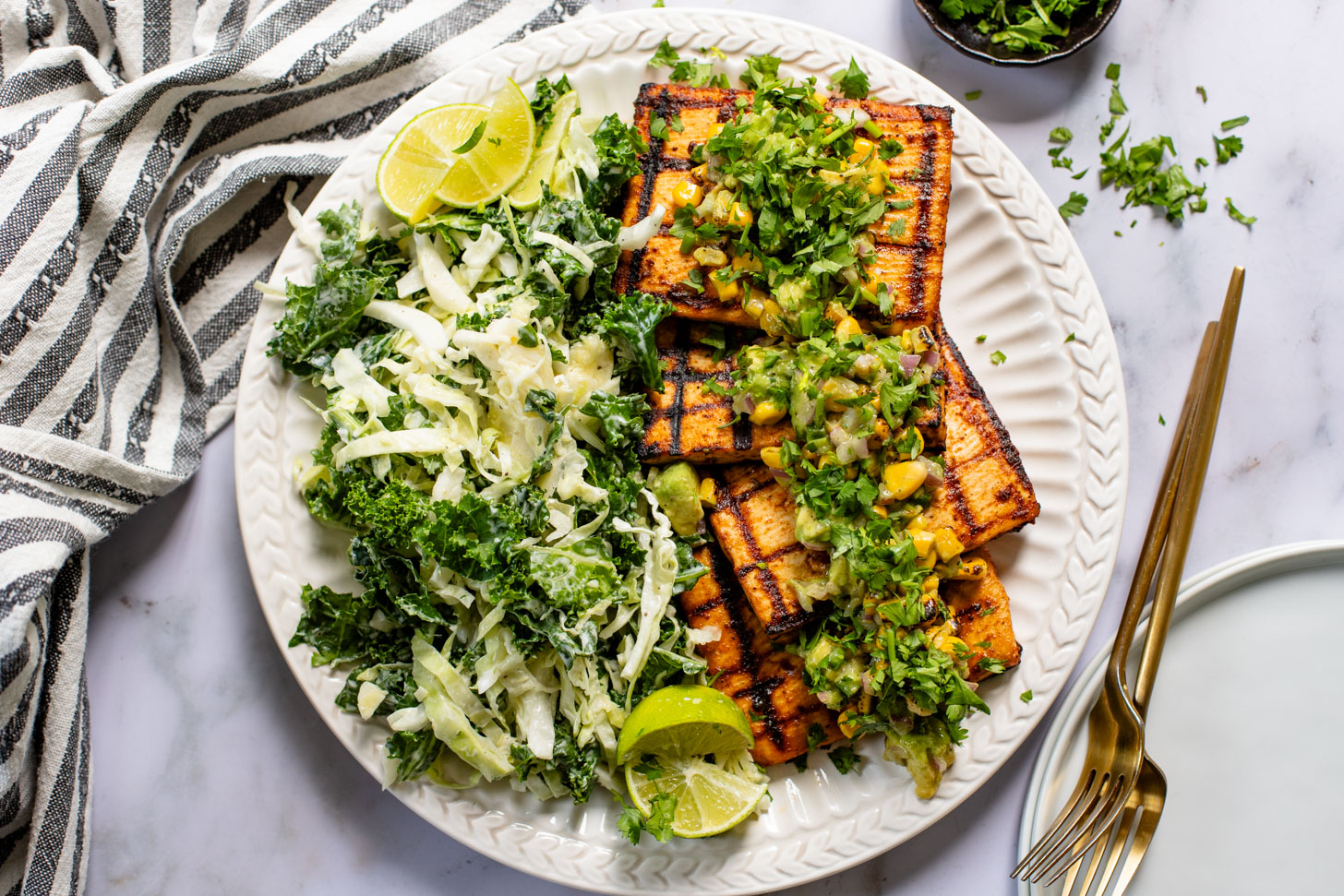 Get ready for grilling season with these Chipotle Tofu Steaks with Avocado Corn Salsa - made with Nasoya's Super Firm Tofu and grilled until crispy | ThisSavoryVegan.com