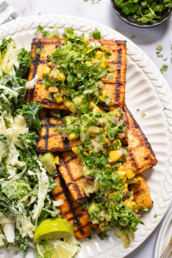 Get ready for grilling season with these Chipotle Tofu Steaks with Avocado Corn Salsa - made with Nasoya's Super Firm Tofu and grilled until crispy | ThisSavoryVegan.com