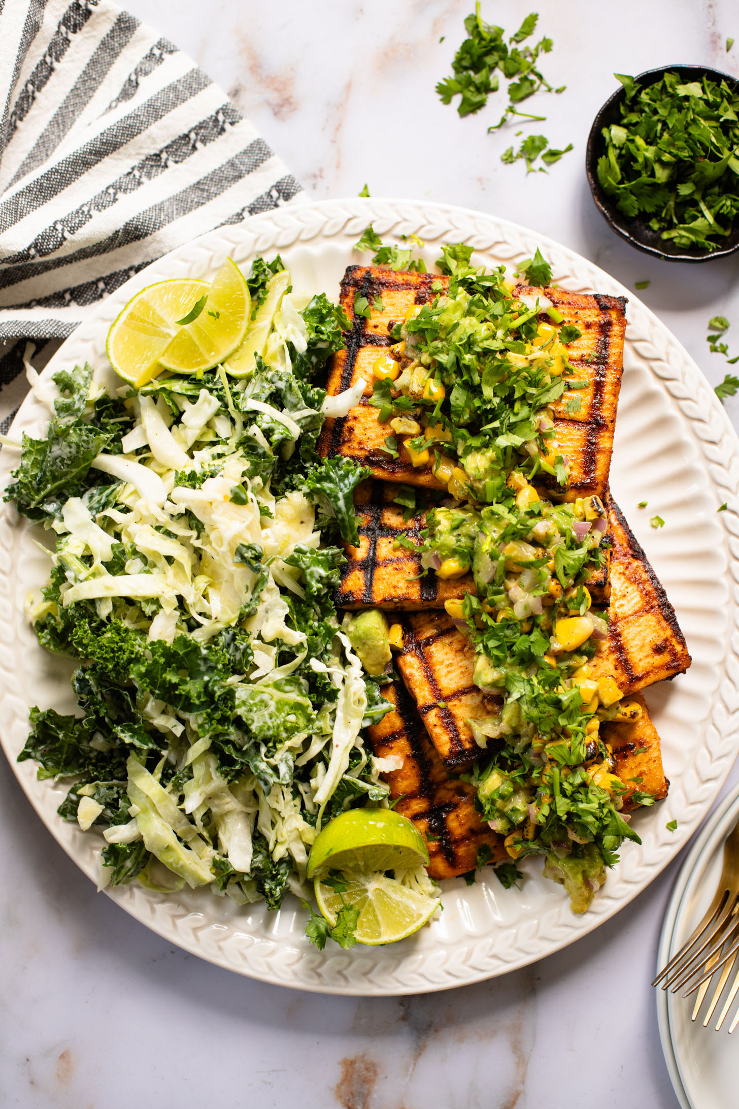 Get ready for grilling season with these Chipotle Tofu Steaks with Avocado Corn Salsa - made with Nasoya's Super Firm Tofu and grilled until crispy | ThisSavoryVegan.com