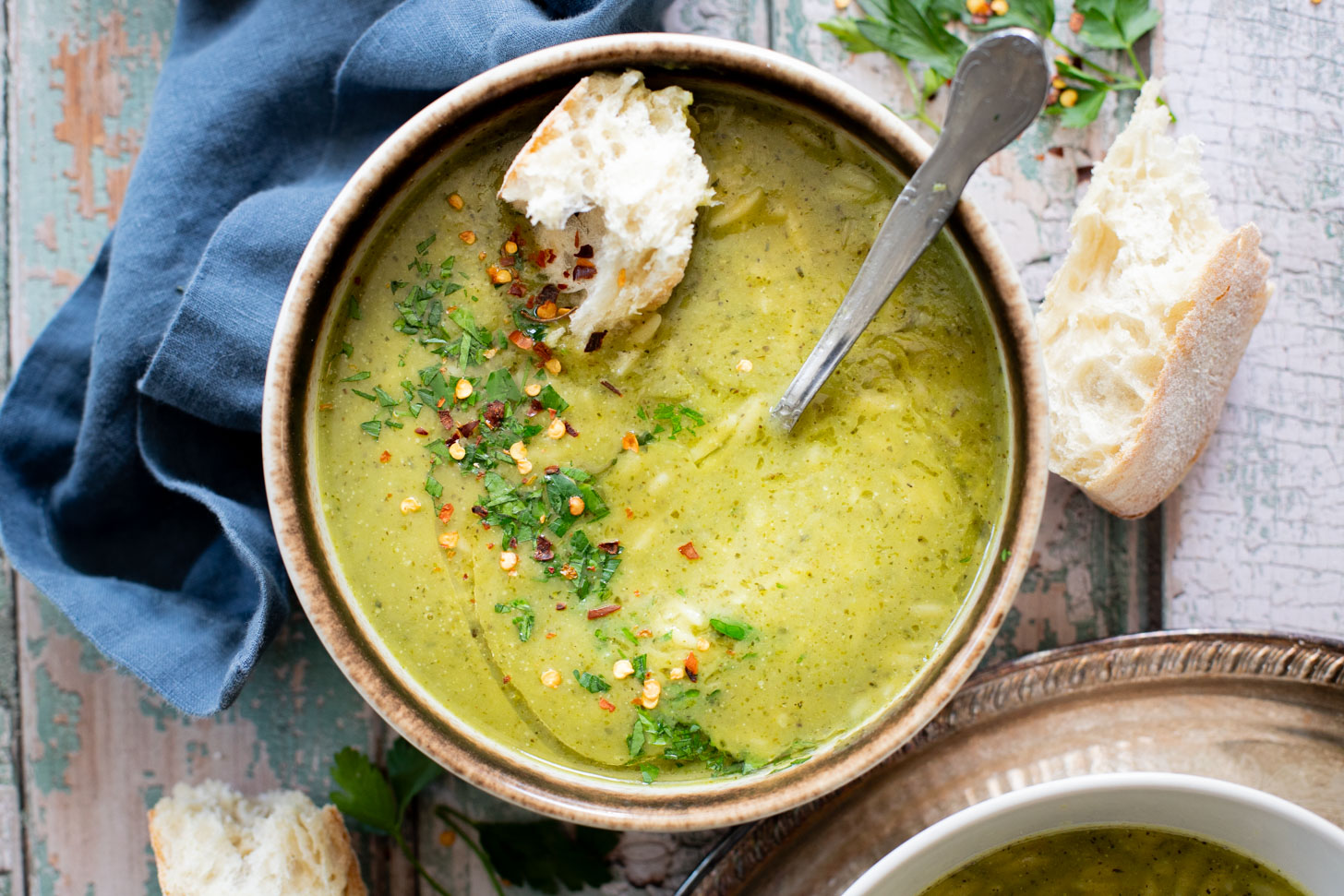 This Creamy Zucchini Pesto Soup is 100% dairy-free! A creamy pesto, & zucchini base is mixed with orzo for the perfect bite | ThisSavoryVegan.com