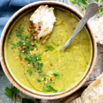 This Creamy Zucchini Pesto Soup is 100% dairy-free! A creamy pesto, & zucchini base is mixed with orzo for the perfect bite | ThisSavoryVegan.com