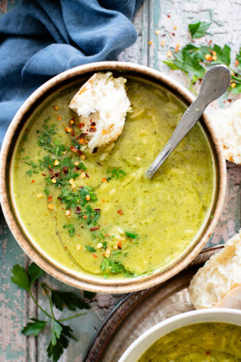 This Creamy Zucchini Pesto Soup is 100% dairy-free! A creamy pesto, & zucchini base is mixed with orzo for the perfect bite | ThisSavoryVegan.com