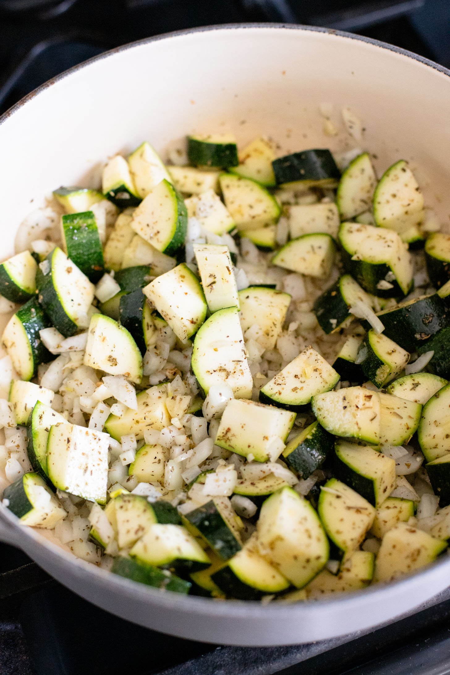 This Creamy Zucchini Pesto Soup is 100% dairy-free! A creamy pesto, & zucchini base is mixed with orzo for the perfect bite | ThisSavoryVegan.com