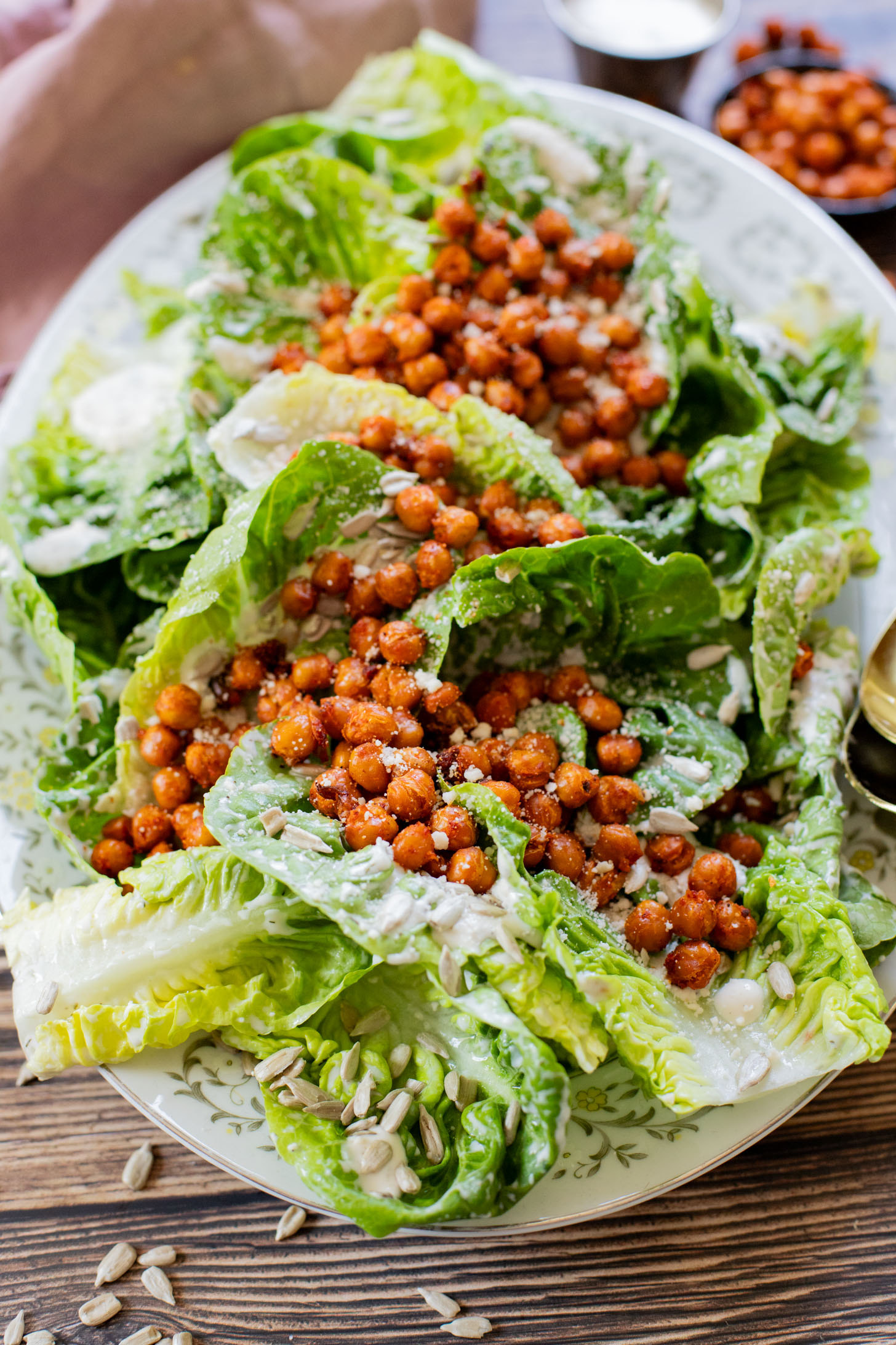 This Little Gem Vegan Ranch Salad is loaded with crisp lettuce, creamy vegan ranch, sunflower seeds and crispy harissa chickpeas | ThisSavoryVegan.com