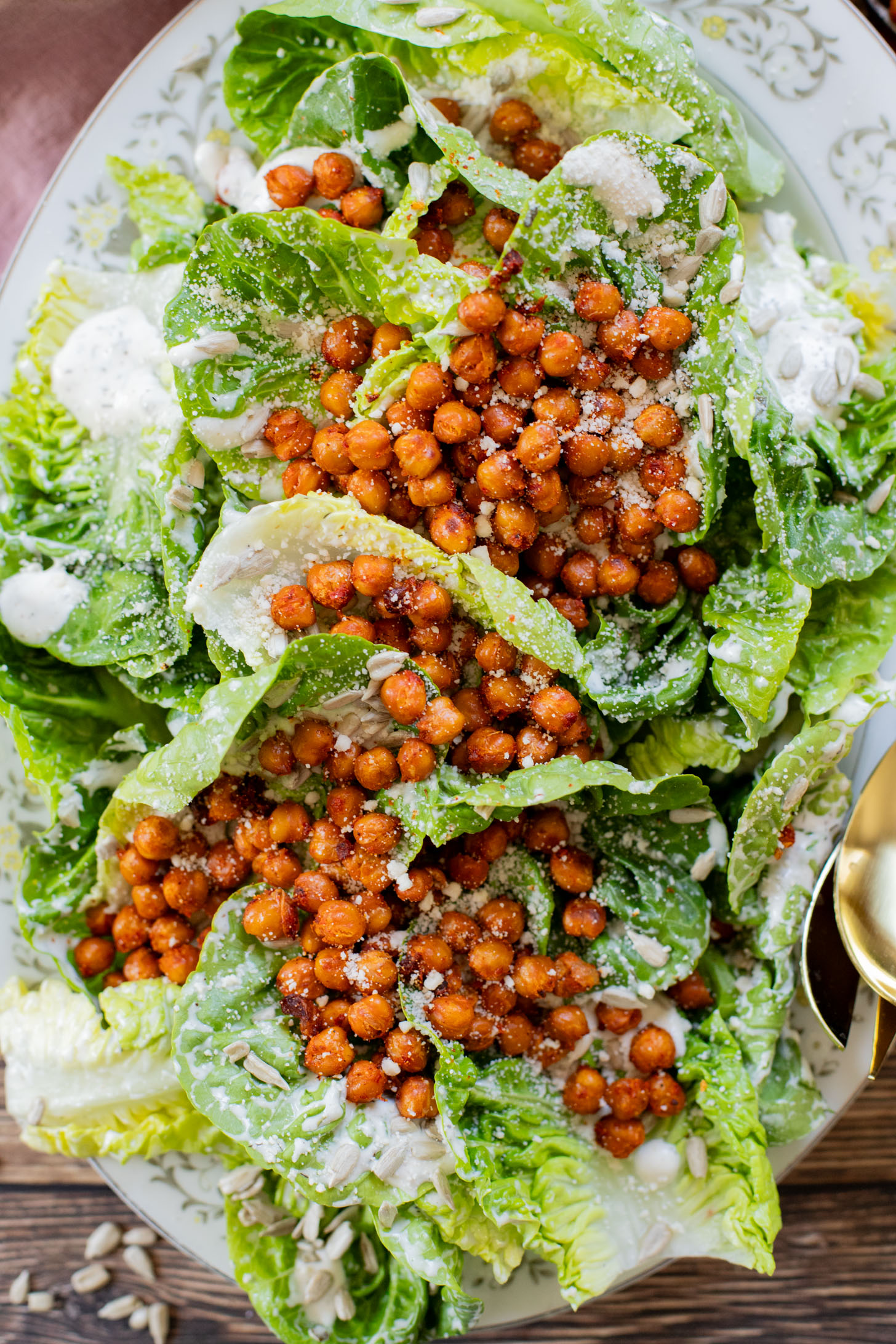 This Little Gem Vegan Ranch Salad is loaded with crisp lettuce, creamy vegan ranch, sunflower seeds and crispy harissa chickpeas | ThisSavoryVegan.com