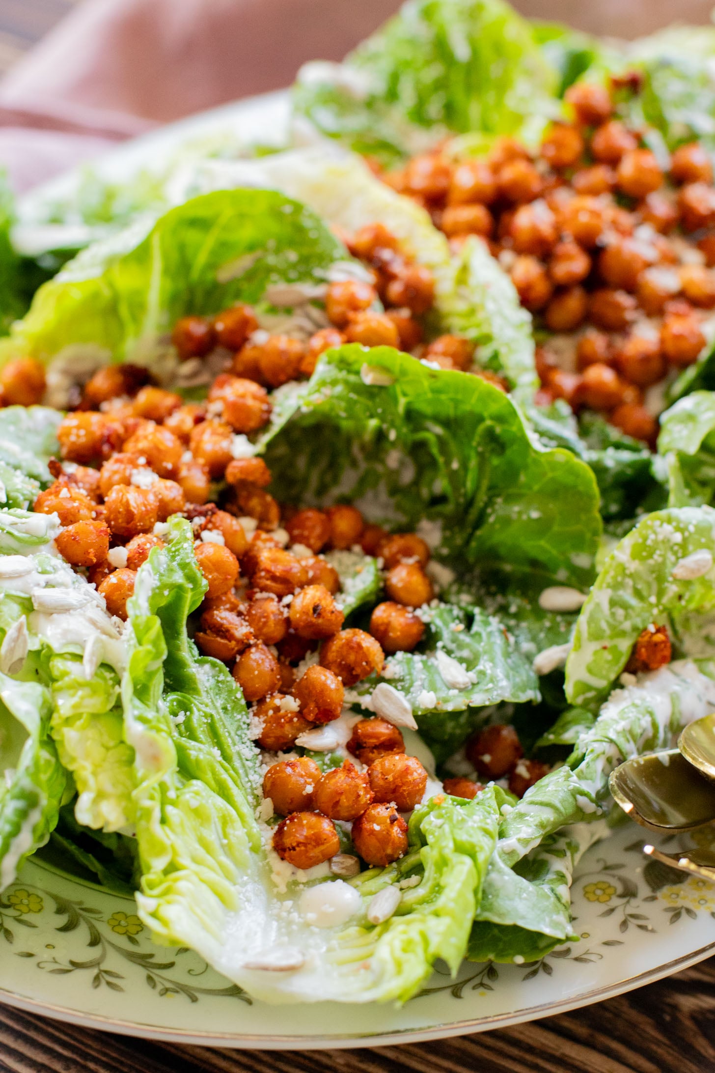 This Little Gem Vegan Ranch Salad is loaded with crisp lettuce, creamy vegan ranch, sunflower seeds and crispy harissa chickpeas | ThisSavoryVegan.com