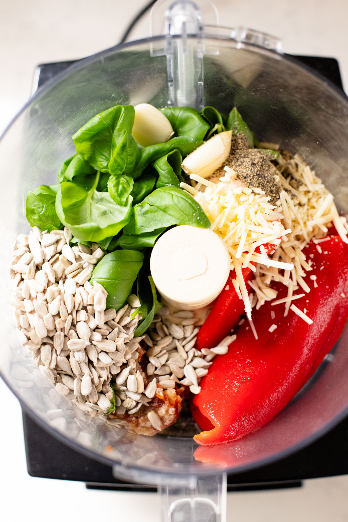 This Pesto Tortellini Pasta Salad is made with a vegan red pepper pesto, tomatoes & arugula. A great vegan side dish for a BBQ | ThisSavoryVegan.com