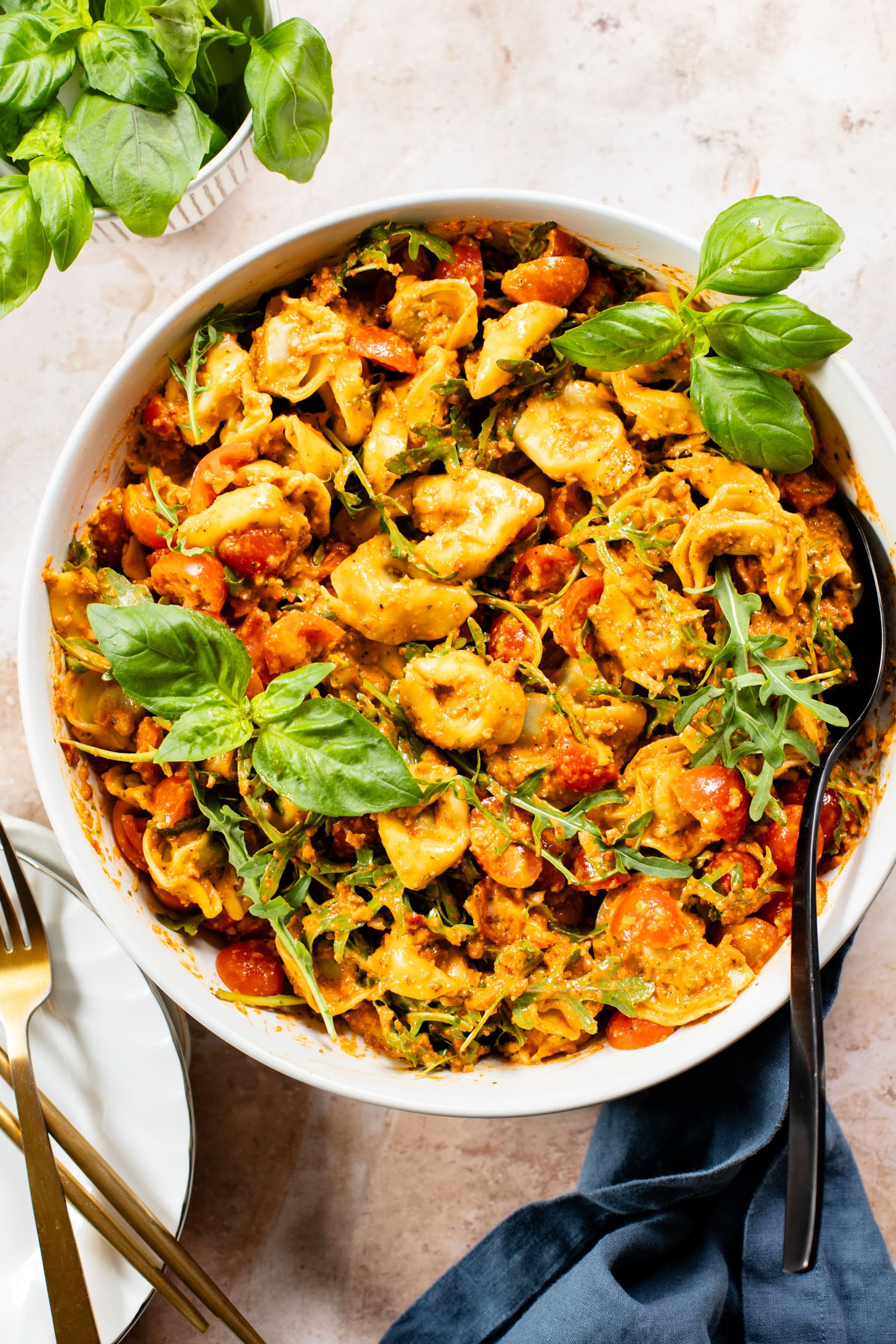 This Pesto Tortellini Pasta Salad is made with a vegan red pepper pesto, tomatoes & arugula. A great vegan side dish for a BBQ | ThisSavoryVegan.com